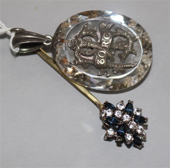 A silver mounted paste pendant and one other pendant.